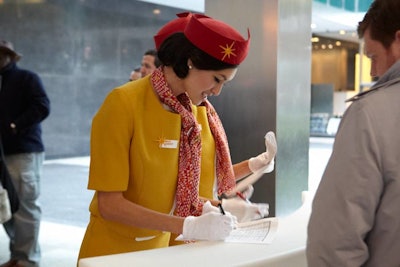 At the entrance to the event, which was set up in the courtyard adjacent to the restaurant, staffers dressed as flight attendants checked in guests.