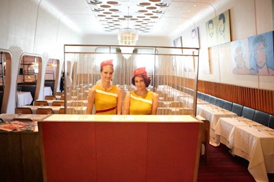 Inside Casa Lever, the hostess stand was remade as the departure gate counter, where guests could check their tickets against a seating chart.