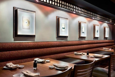 On the first floor, the main dining room holds 95 and has a sushi bar in back.