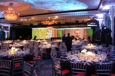 To make the Regency Ballroom ceiling appear higher on television, InFrame Designs projected blue light onto the ceiling. Video vignettes of each author were displayed on the screen that served as a backdrop for the stage.