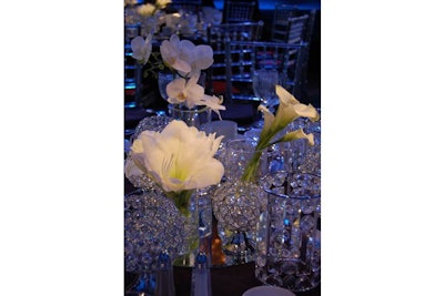 Pick Ontario supplied white floral centrepieces with crystal votives from Crystal World.