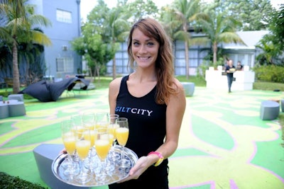 In the courtyard, shoppers could enjoy cocktails while lounging on furniture provided by Lavish Event Rentals.