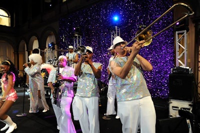 During the after-party, the Right On Band performed in front of a glittery backdrop while wearing equally glittery costumes.