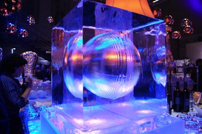 Large cubes of ice with a hollow sphere sat on the corners of the square bar on the trading floor.