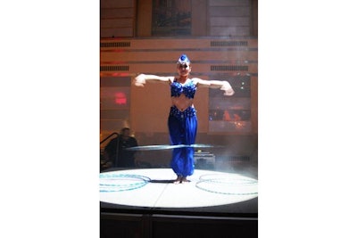 Contortionists and acrobats from Zero Gravity Circus performed on stage on the trading floor. Aerialists also performed over the Crystal Head martini bar.