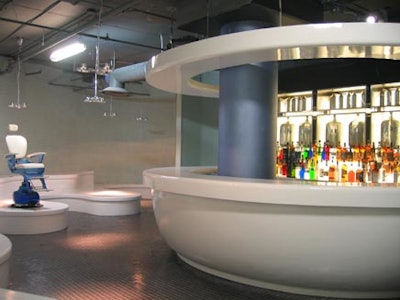 A large ceramic toilet-bowl-shaped bar is the focal point in the Bathroom Bar at Circa.