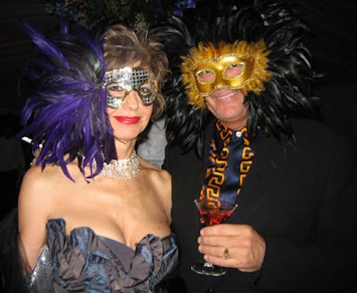 Eventgoers adhered to the night's flamboyant theme with feathered and sequined masks.