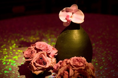 Spare orchids and roses decorated the standing tables in the gala space.