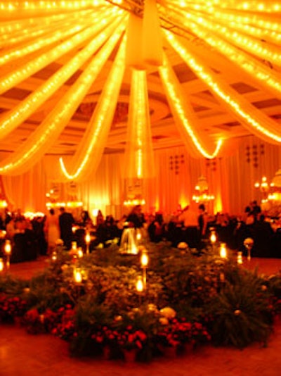 Even the dance floor was adorned with a tropical oasis complete with candles, dense green vegetation, metallic orbs, and a fountain in the center.