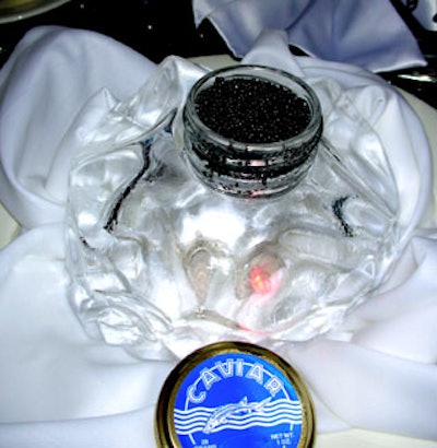 At their tables, guests each found a tin of caviar situated on a mound of carved ice at each place setting.