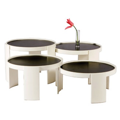 A set of four nesting tables interlock or come apart to use separately; each has a reversible black or cream top. The set rents for $165 and is available in New York from Taylor Creative Props.