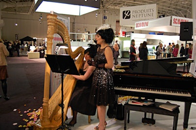 A harpist and a singer performed on a flower-petal-bordered stage at the Interior Design Show's Decadence party.