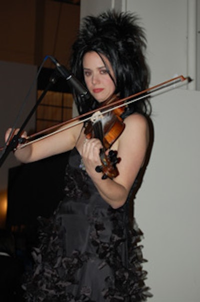 A violinist performed at one of the small stages located throughout the show.