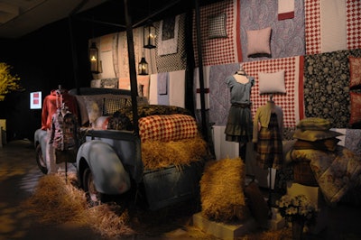 David Stark's vignettes mixed hay bales and a pickup truck with bedding and apparel from the new line.