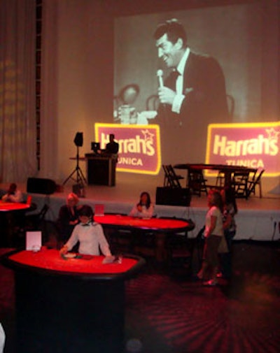 Black-and-white videos of the Rat Pack's Las Vegas performances were projected onto the big screen above the stage.