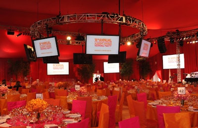 A bright palette of orange and pink dominated this year's fund-raising dinner, where copious TVs made viewing available from all angles.