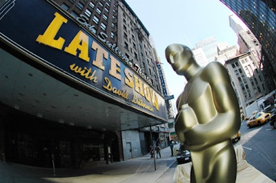 Despite traffic, the trailer bearing the statues toured the theater district.