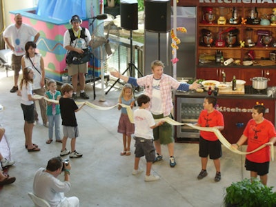 Jamie Oliver engaged and involved the crowd by creating 'the world's longest tagliatelle'-the top layer of pasta for lasagna-which took seven kids to hold up.