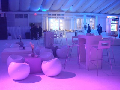 White modular furniture was arranged throughout the tent, providing spaces for intimate conversation among guests.