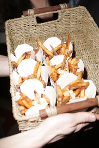 Servers passed takeout containers of spicy fries in large baskets.