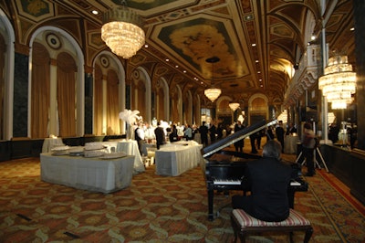 The cocktail reception in the ballroom was simply decorated, with shimmery blue tablecloths and white hydrangeas.