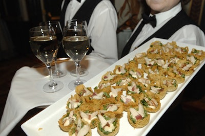Appetizers at the cocktail reception including smoked chicken Caesar salad in baked pastry cups.