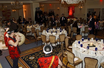 Japanese drummers played at the National Cherry Blossom Festival dinner. Tabletops featured pink details and centerpieces of small stones and pink blossoms.