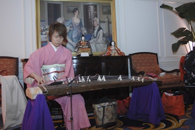 A koto musician performed at the event's entrance.