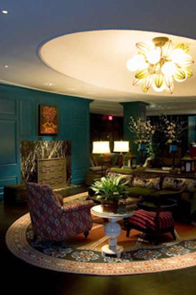Also known as the living room, the lobby features Adriatic blue walls, a fireplace, and cozy chairs and couches.