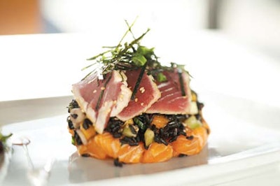 Black rice salad with seared tuna, salmon poke, and papaya, topped with citrus vinaigrette and passion fruit from Los Angeles-based Food Perfected