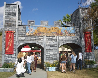 Guests enter the festival through a castle archway.