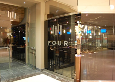Smoked-glass windows front the restaurant in Commerce Court South.