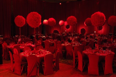 Red feather balls on tall red batons served as centrepieces in the dining room.