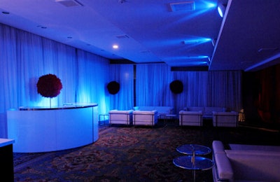 White couches and tables dressed the dessert lounge, which was illuminated with blue light.