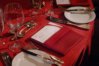 Red cloth napkins folded into squares held the evening's program and menu.