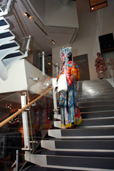 A Chinese opera singer regaled the attendees from her position on the stairs.