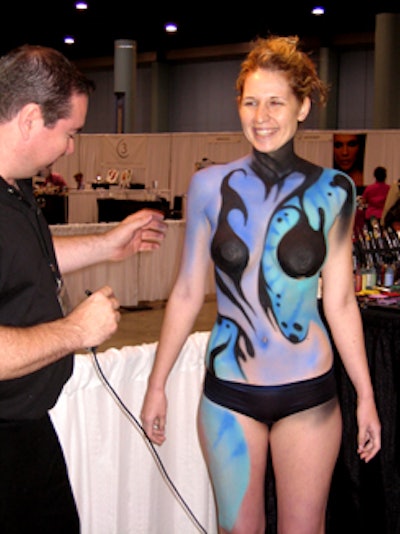 Multiple companies throughout the convention center demonstrated their airbrushing products and techniques on live models.