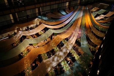 Evoking Isaac Mizrahi's colorful costumes, long, pastel-colored strips of fabric covered the dinner area, shaped to look like a tent by wires and a circular frame.