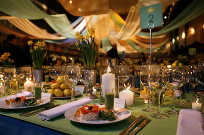 Each table held arrangements of daffodils in pewter chalices and mugs, as well as platters of lemons.