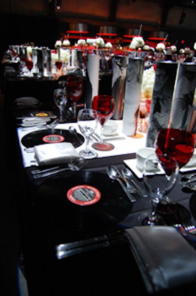 Table settings consisted of records as charger plates, red water goblets, satin napkins, and paper tubes filled with guests' gifts—authentic Life magazines from the 1950s.
