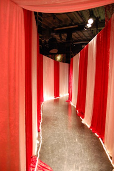 A tunnel from the cocktail reception to the dining area was made from 600 metres of red and white fabric.