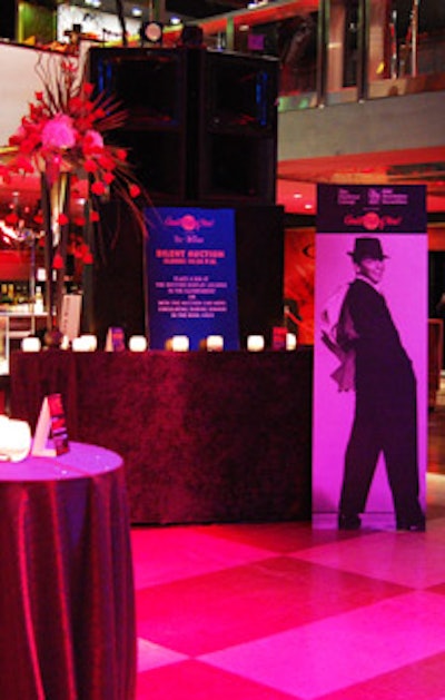 Tall poster boards with images of '50s icons such as Marilyn Monroe, Frank Sinatra, and Muhammad Ali decorated the cocktail reception area.