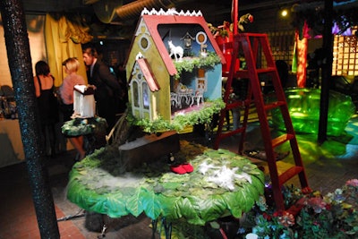 Redmoon Theater is known for inventive set design, as showcased in a fanciful dollhouse staged near the party's entrance.