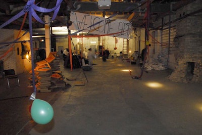 Once inside, guests found a faux party featuring half-hearted decorations and performers serving pizza and canned beer.