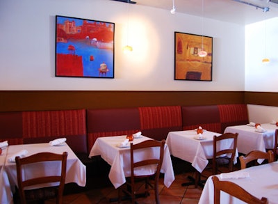 Paintings by Gregory Burns, which hang throughout the 3,500-square-foot restaurant, inspired the contemporary decor.