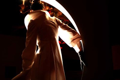 Models posed under archways in the Le Sang des Betes installation.