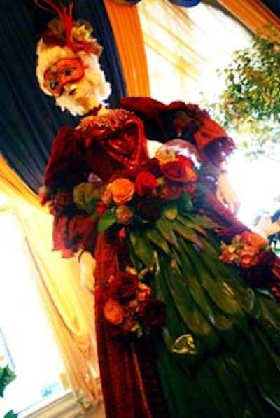 A mannequin outfitted in a dress partially made of fabric and botanicals added a unique element to the decor.