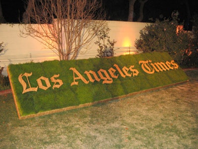 A prominent sign made from wheatgrass and kirei wood, bearing the name of event co-sponsor The Los Angeles Times, decorated the lawn.