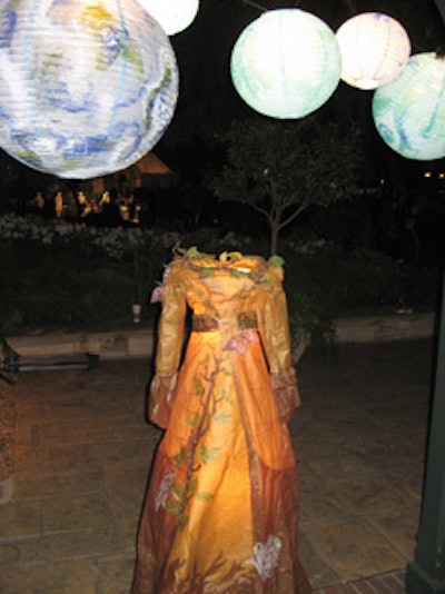 Dresses representing earth, life, water, and plants sat at the entrance to the mayor's backyard.
