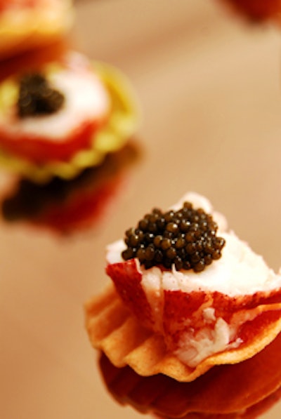 Palm Beach Catering served Maine lobster medallions on vegetable chips with sriracha aioli - a Thai hot sauce - and caviar garnish.